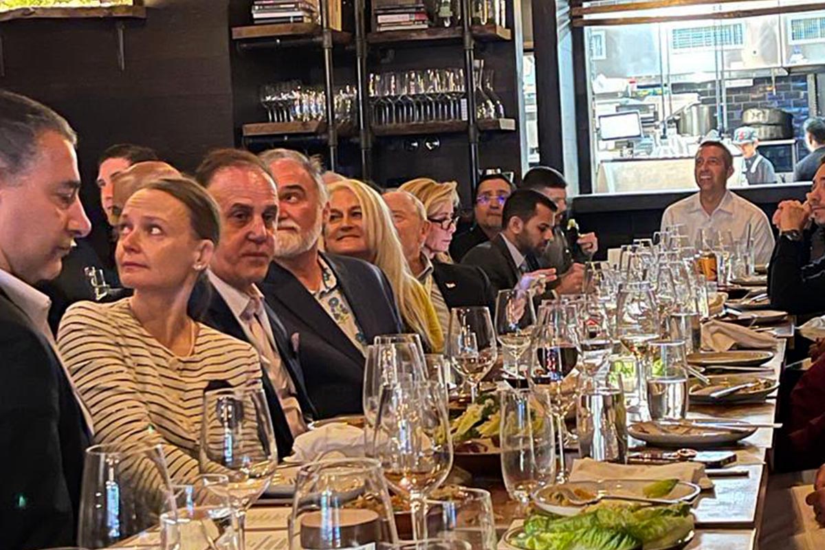 Members at a private investor dinner