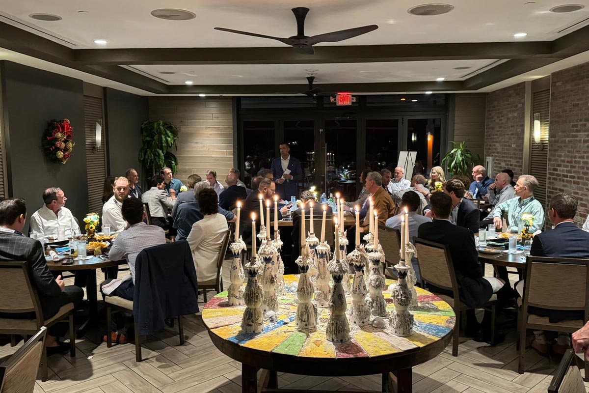 Members at a candlelit group dinner
